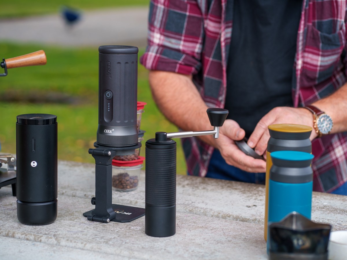 Portable coffee-making equipment on a park bench.